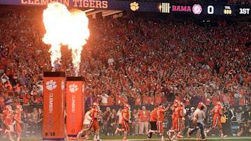 Jan 11, 2016; Glendale, AZ, USA; The Clemson Tigers run onto the field before playing against the Alabama Crimson Tide in the 2016 CFP National Championship at University of Phoenix Stadium. Mandatory Credit: Joe Camporeale-USA TODAY Sports