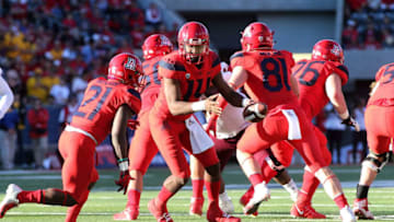 TUCSON, AZ - NOVEMBER 24: Quarterback Khalil Tate #14 of the Arizona Wildcats looks to hand the ball off to running back J.J. Taylor #21 of the Wildcats during the first half of the college football game against the Arizona State Sun Devils at Arizona Stadium on November 24, 2018 in Tucson, Arizona. (Photo by Ralph Freso/Getty Images)
