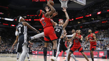 SAN ANTONIO, TX - NOVEMBER 02: Zach Collins #23 of the San Antonio Spurs blocks a shot attempt by Precious Achiuwa #5 of the Toronto Raptors (Photo by Ronald Cortes/Getty Images)
