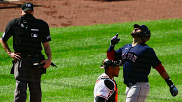 Apr 11, 2021; Baltimore, Maryland, USA; Boston Red Sox left fielder J.D. Martinez (28) celebrates hitting a solo home run after crossing home plate as Baltimore Orioles catcher Pedro Severino (28) looks on in the eighth inning at Oriole Park at Camden Yards. Mandatory Credit: Tommy Gilligan-USA TODAY Sports