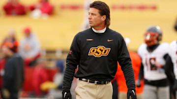 AMES, IA - NOVEMBER 11: Head coach Mike Gundy of the Oklahoma State Cowboys coaches during warm ups before game action against the Iowa State Cyclones at Jack Trice Stadium on November 11, 2017 in Ames, Iowa. The Oklahoma State Cowboys won 49-42 over the Iowa State Cyclones. (Photo by David K Purdy/Getty Images)