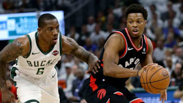 MILWAUKEE, WISCONSIN - MAY 15: Kyle Lowry #7 of the Toronto Raptors dribbles the ball while being guarded by Eric Bledsoe #6 of the Milwaukee Bucks in the first quarter in Game One of the Eastern Conference Finals of the 2019 NBA Playoffs at the Fiserv Forum on May 15, 2019 in Milwaukee, Wisconsin. NOTE TO USER: User expressly acknowledges and agrees that, by downloading and or using this photograph, User is consenting to the terms and conditions of the Getty Images License Agreement. (Photo by Jonathan Daniel/Getty Images)