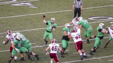 Nov 7, 2020; Huntington, West Virginia, USA; Marshall Thundering Herd quarterback Grant Wells (8) throws a touchdown pass during the third quarter against the Massachusetts Minutemen at Joan C. Edwards Stadium. Mandatory Credit: Ben Queen-USA TODAY Sports