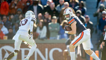 Auburn footballAUBURN, ALABAMA - NOVEMBER 13: Tight end Tyler Fromm #85 of the Auburn Tigers looks to maneuver the ball by cornerback Emmanuel Forbes #13 of the Mississippi State Bulldogs at Jordan-Hare Stadium on November 13, 2021 in Auburn, Alabama. (Photo by Michael Chang/Getty Images)