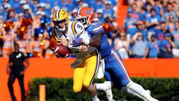 Oct 6, 2018; Gainesville, FL, USA; Florida Gators linebacker Vosean Joseph (11) sacks LSU Tigers quarterback Joe Burrow (9) during the first quarter at Ben Hill Griffin Stadium. Mandatory Credit: Kim Klement-USA TODAY Sports