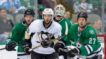 Oct 8, 2015; Dallas, TX, USA; Dallas Stars defenseman Jason Demers (4) and left wing Travis Moen (27) defend against Pittsburgh Penguins center Nick Bonino (13) during the game at the American Airlines Center. The Stars shut out the Penguins 3-0. Mandatory Credit: Jerome Miron-USA TODAY Sports