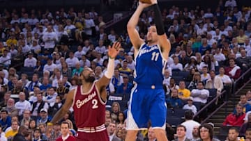 December 25, 2015; Oakland, CA, USA; Golden State Warriors guard Klay Thompson (11) shoots the basketball against Cleveland Cavaliers guard Kyrie Irving (2) in the third quarter of a NBA basketball game on Christmas at Oracle Arena. The Warriors defeated the Cavaliers 89-83. Mandatory Credit: Kyle Terada-USA TODAY Sports