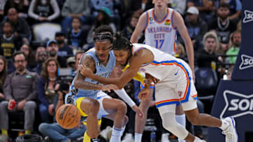 Ja Morant #12 of the Memphis Grizzlies and Isaiah Joe #11 of the Oklahoma City Thunder (Photo by Justin Ford/Getty Images)