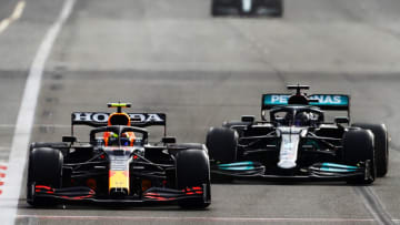 Sergio Perez, Red Bull, and Lewis Hamilton, Mercedes, Formula 1 (Photo by Francois Nel/Getty Images)