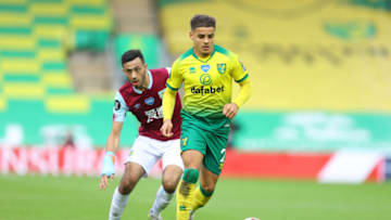 Max Aarons, Norwich City and Dwight McNeil, Burnley battle for the ball during the Premier League match between Norwich City and Burnley FC. (Photo by Julian Finney/Getty Images)