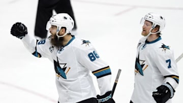 Apr 2, 2016; Nashville, TN, USA; San Jose Sharks defenseman Brent Burns (88) and defenseman Paul Martin (7) celebrate after a goal during the third period against the Nashville Predators at Bridgestone Arena. Mandatory Credit: Christopher Hanewinckel-USA TODAY Sports