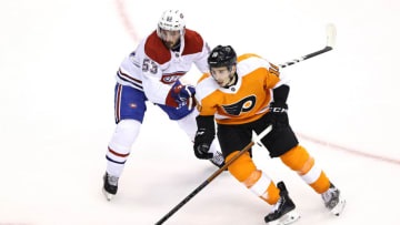Tyler Pitlick #18 of the Philadelphia Flyers and Victor Mete #53 of the Montreal Canadiens (Photo by Elsa/Getty Images)