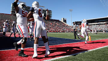 TUCSON, ARIZONA - NOVEMBER 13: Running back Michael Wiley #6 of the Arizona Wildcats celebrates with teammates after scoring on a six-yard touchdown reception against the Utah Utes during the first half of the NCAAF game at Arizona Stadium on November 13, 2021 in Tucson, Arizona. (Photo by Christian Petersen/Getty Images)
