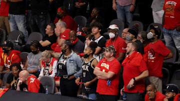 Jul 3, 2021; Atlanta, Georgia, USA; Atlanta Hawks fans react in the closing minutes of the Hawks loss to the Milwaukee Bucks in game six of the Eastern Conference Finals for the 2021 NBA Playoffs at State Farm Arena. Mandatory Credit: Jason Getz-USA TODAY Sports