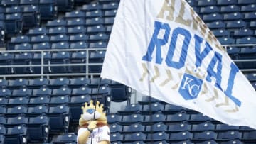 Aug 6, 2020; Kansas City, Missouri, USA; The Kansas City Royals mascot Sluggerrr waves an Always Royal flag in empty stands before the game against the Chicago Cubs at Kauffman Stadium. Mandatory Credit: Denny Medley-USA TODAY Sports