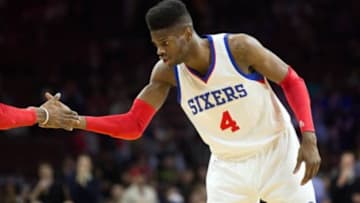 Feb 9, 2015; Philadelphia, PA, USA; Philadelphia 76ers center Nerlens Noel (4) is congratulated by forward Robert Covington (not pictured) after a score against the Golden State Warriors during the first quarter at Wells Fargo Center. Mandatory Credit: Bill Streicher-USA TODAY Sports