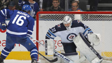 TORONTO,ON - JANUARY 8: Connor Hellebuyck #37 of the Winnipeg Jets stops Mitchell Marner #16 of the Toronto Maple Leafs in the shoot-out during an NHL game at Scotiabank Arena on January 8, 2020 in Toronto, Ontario, Canada. The Jets defeated the Maple Leafs 4-3 in a shootout. (Photo by Claus Andersen/Getty Images)