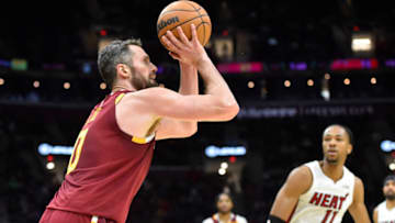 Dec 13, 2021; Cleveland, Ohio, USA; Cleveland Cavaliers forward Kevin Love (0) shoots a three-point basket in the fourth quarter against the Miami Heat at Rocket Mortgage FieldHouse. Mandatory Credit: David Richard-USA TODAY Sports