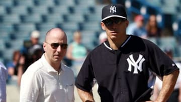 Feb 21, 2015; Tampa, FL, USA; New York Yankees manager Joe Girardi (right) and generial manager Brian Cashman during spring training workouts at George M. Steinbrenner Field. Mandatory Credit: Kim Klement-USA TODAY Sports