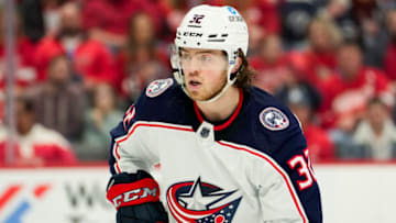Apr 9, 2022; Detroit, Michigan, USA; Columbus Blue Jackets defenseman Jake Christiansen (32) keeps his eyes on the puck during the second period against the Detroit Red Wings at Little Caesars Arena. Mandatory Credit: Raj Mehta-USA TODAY Sports