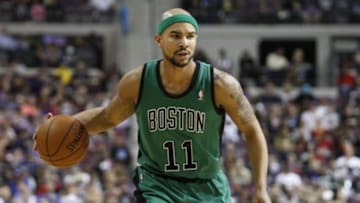 Apr 5, 2014; Auburn Hills, MI, USA; Boston Celtics guard Jerryd Bayless (11) dribbles the ball during the second quarter against the Detroit Pistons at The Palace of Auburn Hills. Mandatory Credit: Raj Mehta-USA TODAY Sports