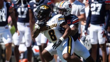 Auburn footballMissouri Tigers running back Nathaniel Peat (8) runs the ball taken down by Auburn Tigers linebacker Owen Pappoe (0) as Auburn Tigers take on Missouri Tigers at Jordan-Hare Stadium in Auburn, Ala., on Saturday, Sept. 24, 2022.