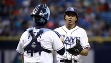 Sep 11, 2015; St. Petersburg, FL, USA; Tampa Bay Rays starting pitcher Chris Archer (22) talks with catcher Rene Rivera (44) against the Boston Red Sox during the first inning at Tropicana Field. Mandatory Credit: Kim Klement-USA TODAY Sports