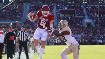 NORMAN, OK - NOVEMBER 12: Quarterback Baker Mayfield #6 of the Oklahoma Sooners scores in front of safety Orion Stewart #28 of the Baylor Bears November 12, 2016 at Gaylord Family-Oklahoma Memorial Stadium in Norman, Oklahoma. (Photo by Brett Deering/Getty Images)