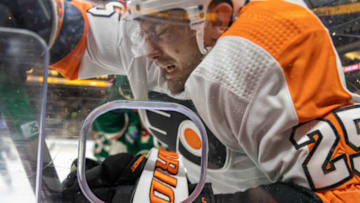 Jan 26, 2023; Saint Paul, Minnesota, USA; Philadelphia Flyers left wing James van Riemsdyk (25) gets checked by a Minnesota Wild player in the third period at Xcel Energy Center. Mandatory Credit: Matt Blewett-USA TODAY Sports