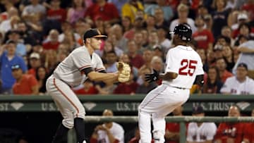 Jun 16, 2016; Boston, MA, USA; Baltimore Orioles starting pitcher Tyler Wilson (63) tags out Boston Red Sox center fielder Jackie Bradley Jr. (25) to end the seventh inning at Fenway Park. Mandatory Credit: David Butler II-USA TODAY Sports