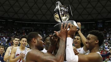 Nov 11, 2016; Honolulu, HI, USA; Arizona Wildcats hold up the trophy after winning against the Michigan State Spartans at the Stan Sheriff Center. Arizona defeats Michigan State 65-63. Mandatory Credit: Brian Spurlock-USA TODAY Sports