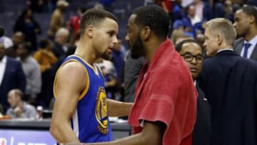 Feb 3, 2016; Washington, DC, USA; Golden State Warriors guard Stephen Curry (30) hugs Washington Wizards guard John Wall (2) after their game at Verizon Center. The Warriors won 134-121. Mandatory Credit: Geoff Burke-USA TODAY Sports