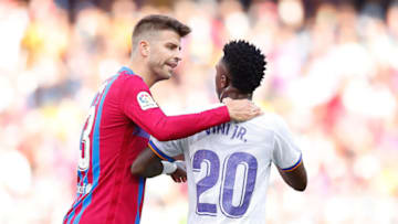Gerard Pique of FC Barcelona speaks with Vinicius Junior of Real Madrid. (Photo by Eric Alonso/Getty Images)