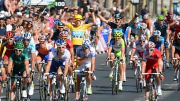 July 22, 2012; Paris, FRANCE; Bradley Wiggins (GBR), in yellow, celebrates after crossing the finish line to win the 2012 Tour de France in Paris. Mandatory Credit: Jerome Prevost/Presse Sports via USA TODAY Sports