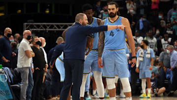 Oct 20, 2021; Memphis, Tennessee, USA; Memphis Grizzles head coach Taylor Jenkins talks with guard Ja Morant (12), forward Jaren Jackson Jr. (13) and center Steven Adams (4) during a time-out during the second half against the Cleveland Cavaliers at FedExForum. Mandatory Credit: Petre Thomas-USA TODAY Sports