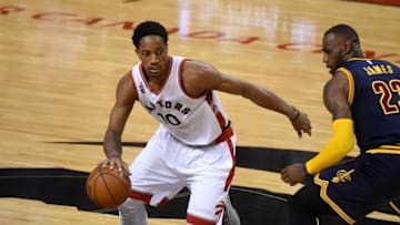 May 21, 2016; Toronto, Ontario, CAN; Toronto Raptors guard DeMar DeRozan (10) dribbles the ball past Cleveland Cavaliers forward LeBron James (23) in game three of the Eastern conference finals of the NBA Playoffs at Air Canada Centre. Mandatory Credit: Dan Hamilton-USA TODAY Sports
