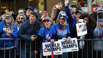 Nov 4, 2016; Chicago, IL, USA; Chicago Cubs fans cheer and take photos during the World Series victory parade on Michigan Avenue. Mandatory Credit: Jerry Lai-USA TODAY Sports