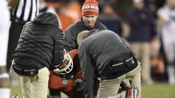 Nov 15, 2014; Athens, GA, USA; Georgia Bulldogs running back Todd Gurley (3) is checked by the medical staff after being injured against the Auburn Tigers during the second half at Sanford Stadium. Georgia defeated Auburn 34-7. Mandatory Credit: Dale Zanine-USA TODAY Sports