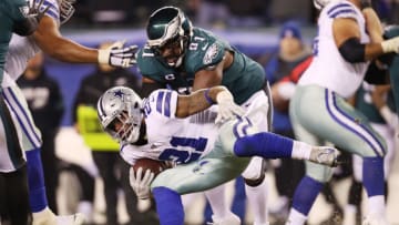 PHILADELPHIA, PENNSYLVANIA - DECEMBER 22: Fletcher Cox #91 of the Philadelphia Eagles attempts to tackle Ezekiel Elliott #21 of the Dallas Cowboys during the second half in the game at Lincoln Financial Field on December 22, 2019 in Philadelphia, Pennsylvania. (Photo by Patrick Smith/Getty Images)