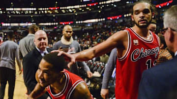 Dec 16, 2015; Chicago, IL, USA; Chicago Bulls guard Derrick Rose (1) and Chicago Bulls center Joakim Noah (13) react after beating the Memphis Grizzlies 98-85 at the United Center. Mandatory Credit: Matt Marton-USA TODAY Sports