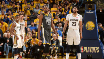 OAKLAND, CA - MAY 1: Kevin Durant #35 of the Golden State Warriors and Anthony Davis #23 of the New Orleans Pelicans look on in Game Two of the Western Conference Semifinals during the 2018 NBA Playoffs on May 1, 2018 at ORACLE Arena in Oakland, California. NOTE TO USER: User expressly acknowledges and agrees that, by downloading and/or using this photograph, user is consenting to the terms and conditions of Getty Images License Agreement. Mandatory Copyright Notice: Copyright 2018 NBAE (Photo by Noah Graham/NBAE via Getty Images)