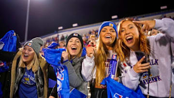 Nov 27, 2021; Lawrence, Kansas, USA; Kansas Jayhawks fans cheer during the first half against the West Virginia Mountaineers at David Booth Kansas Memorial Stadium. Mandatory Credit: Jay Biggerstaff-USA TODAY Sports