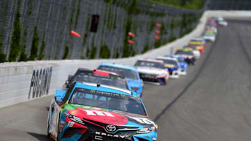 LONG POND, PENNSYLVANIA - JUNE 02: Kyle Busch, driver of the #18 M&M's Hazelnut Toyota, leads a pack of cars during the Monster Energy NASCAR Cup Series Pocono 400 at Pocono Raceway on June 02, 2019 in Long Pond, Pennsylvania. (Photo by Jared C. Tilton/Getty Images)