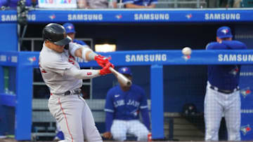 BUFFALO, NY - JULY 21: Enrique Hernandez #5 of the Boston Red Sox hits a two-run home run in the third inning against the Toronto Blue Jays at Sahlen Field on July 21, 2021 in Buffalo, New York. (Photo by Kevin Hoffman/Getty Images)