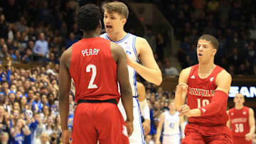 DURHAM, NORTH CAROLINA - JANUARY 18: Joey Baker #13 of the Duke Blue Devils confronts Darius Perry #2 of the Louisville Cardinals during their game at Cameron Indoor Stadium on January 18, 2020 in Durham, North Carolina. (Photo by Streeter Lecka/Getty Images)