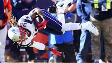 Jan 24, 2016; Denver, CO, USA; New England Patriots running back Brandon Bolden (38) dives forward for extra yardage against the Denver Broncos in the first half in the AFC Championship football game at Sports Authority Field at Mile High. Mandatory Credit: Mark J. Rebilas-USA TODAY Sports