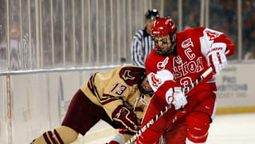 BOSTON - JANUARY 08: Kevin Shattenkirk #3 of the Boston University Terriers takes the puck from Cam Atkinson #13 of the Boston College Eagles on January 8, 2010 during the Sun Life Frozen Fenway Hockey Game at the Fenway Park in Boston, Massachusetts. The Terriers defeated the Eagles 3-2. (Photo by Elsa/Getty Images)