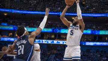 Minnesota Timberwolves guard Malik Beasley shoots over Dallas Mavericks guard Frank Ntilikina. Mandatory Credit: Jerome Miron-USA TODAY Sports