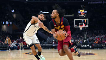 CLEVELAND, OHIO - JANUARY 17: Darius Garland #10 of the Cleveland Cavaliers drives to the basket around Patty Mills #8 of the Brooklyn Nets during the third quarter at Rocket Mortgage Fieldhouse on January 17, 2022 in Cleveland, Ohio. The Cavaliers defeated the Nets 114-107. NOTE TO USER: User expressly acknowledges and agrees that, by downloading and/or using this photograph, user is consenting to the terms and conditions of the Getty Images License Agreement. (Photo by Jason Miller/Getty Images)
