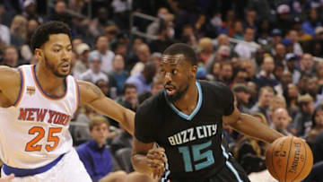 Nov 26, 2016; Charlotte, NC, USA; Charlotte Hornets guard Kemba Walker (15) drives past New York Knicks guard Derrick Rose (25) during the second half of the game at the Spectrum Center. Hornets win 107-102. Mandatory Credit: Sam Sharpe-USA TODAY Sports